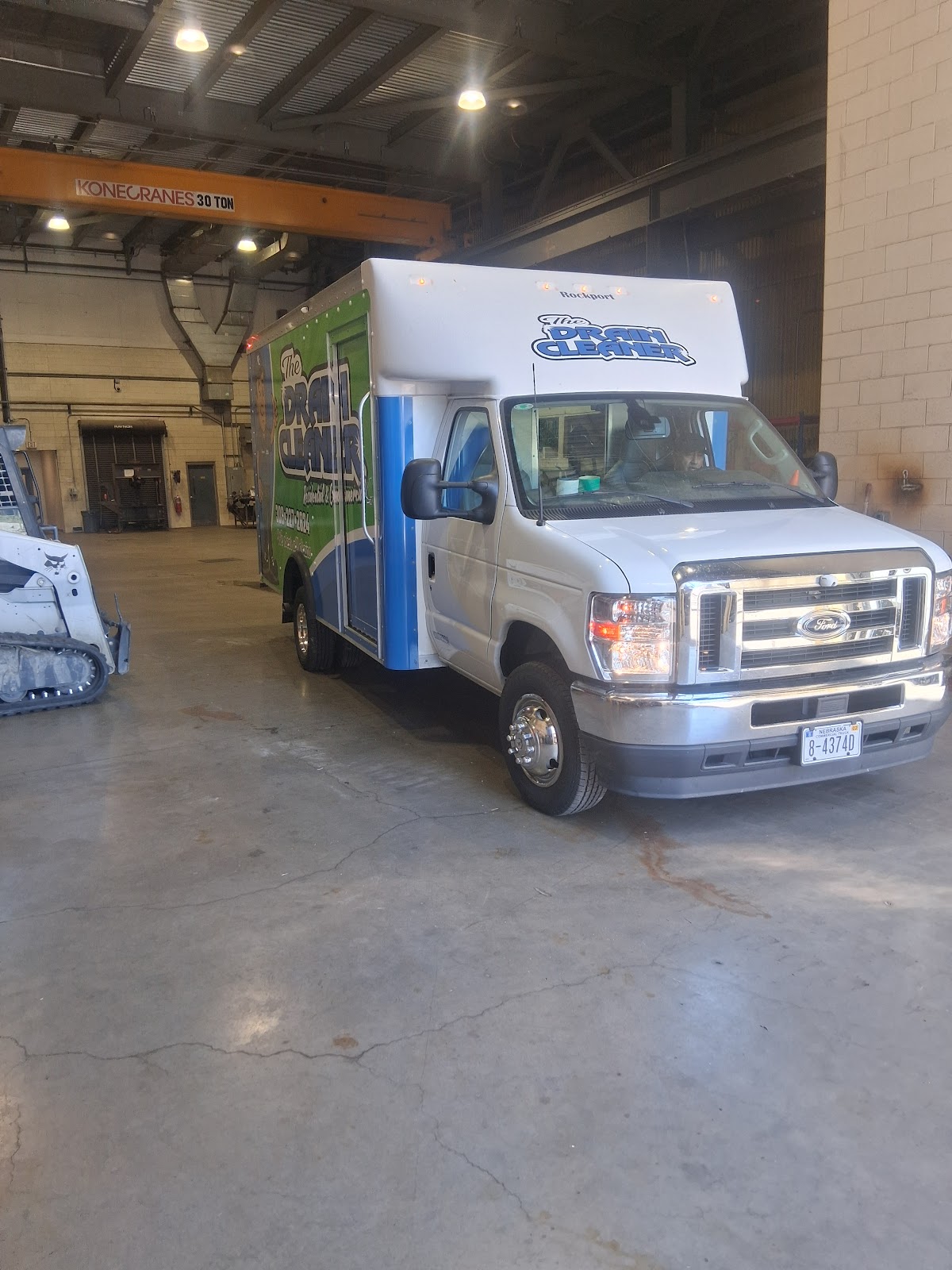 The Drain Cleaner box truck with green and blue livery