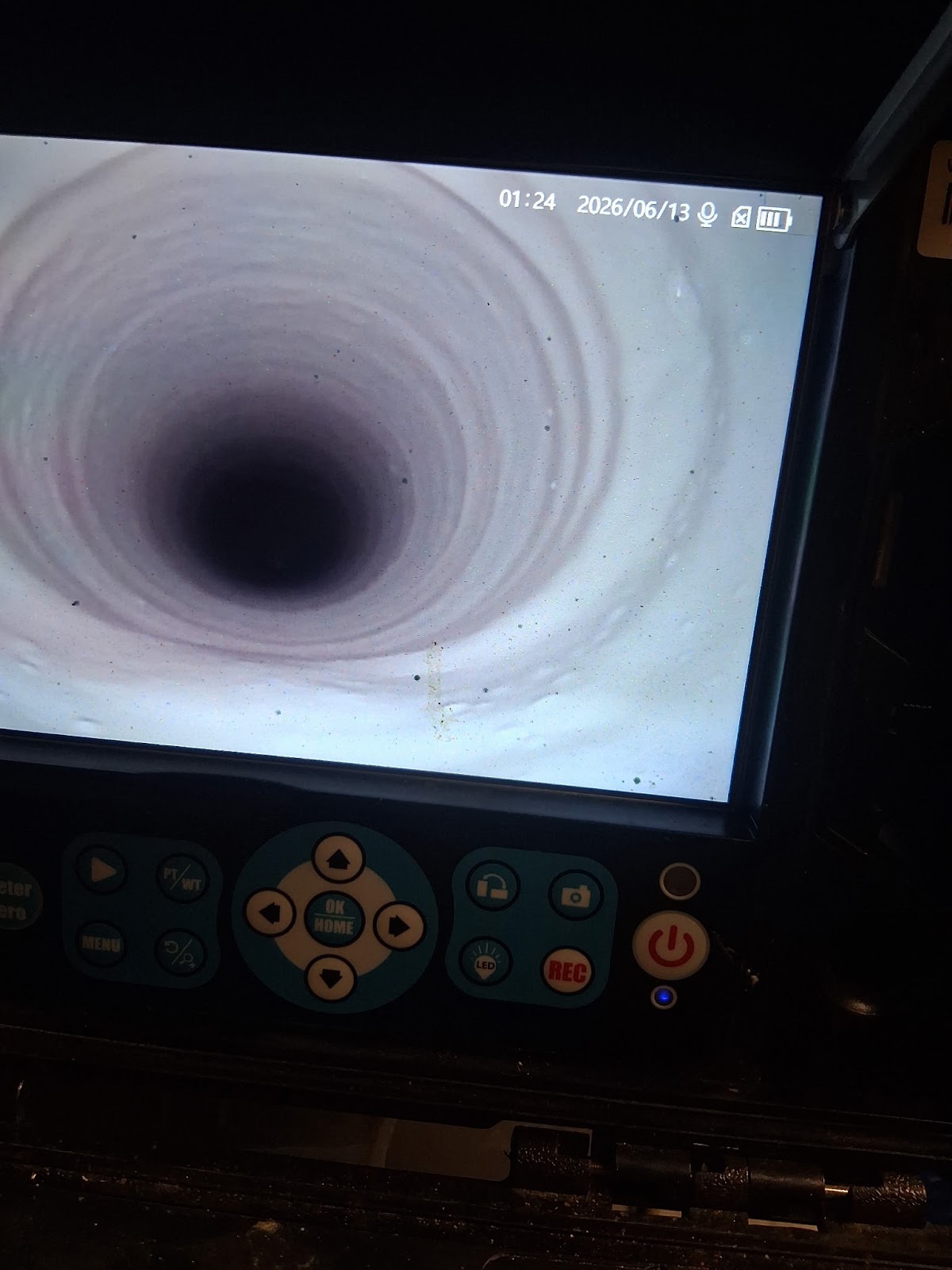 Sewer camera monitor showing the inside of a pipe