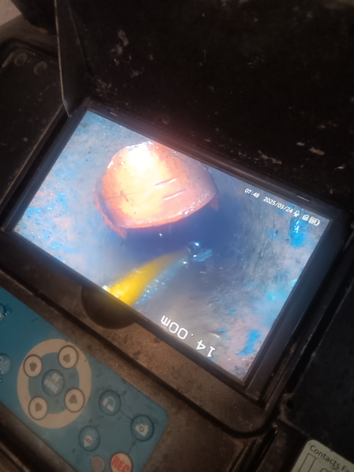 Inspection monitor showing a blockage inside a pipe